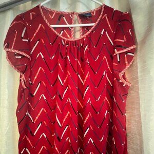 Sleeveless top with pencil/pen design